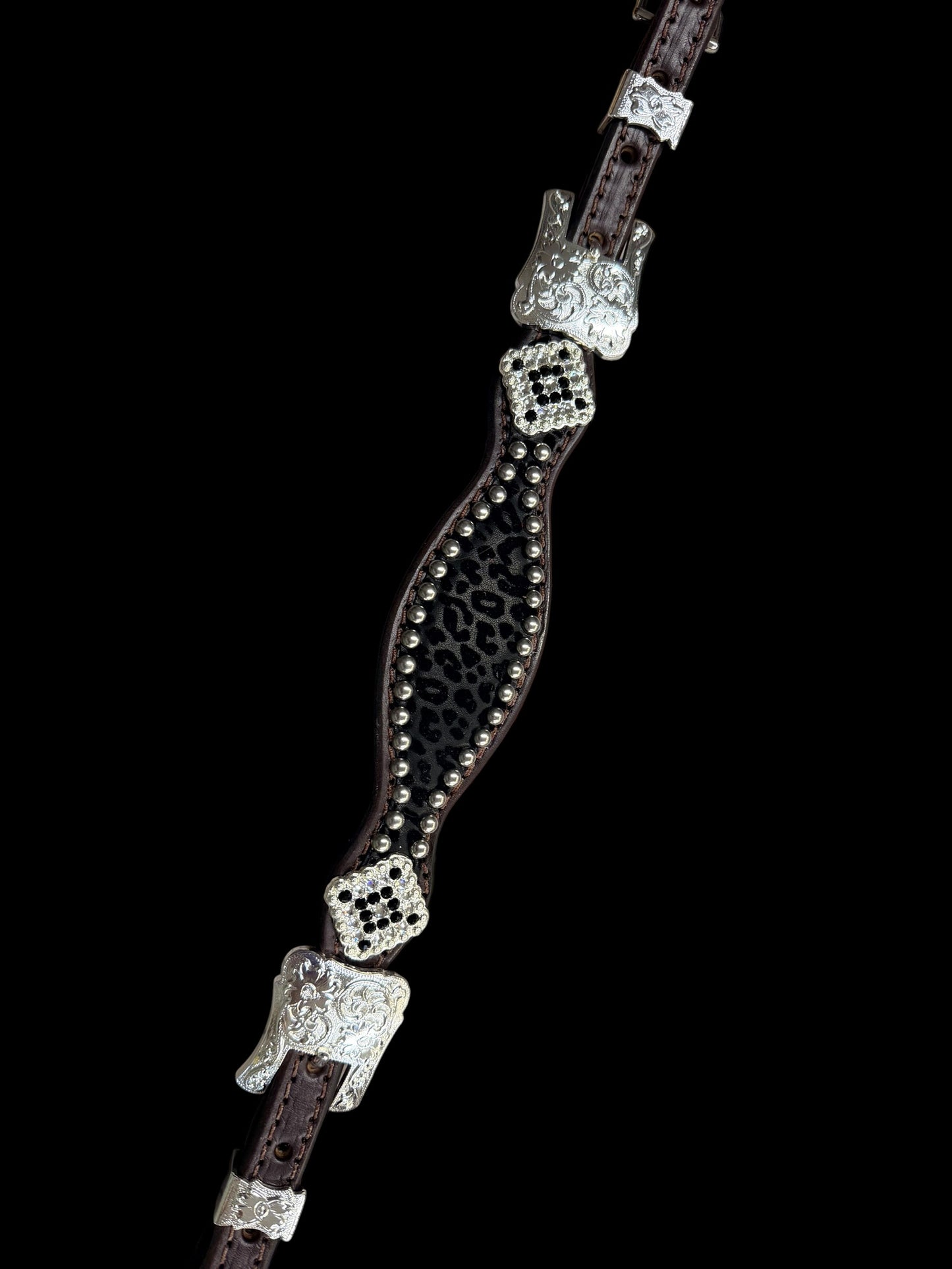 Black flocked leopard on dark leather