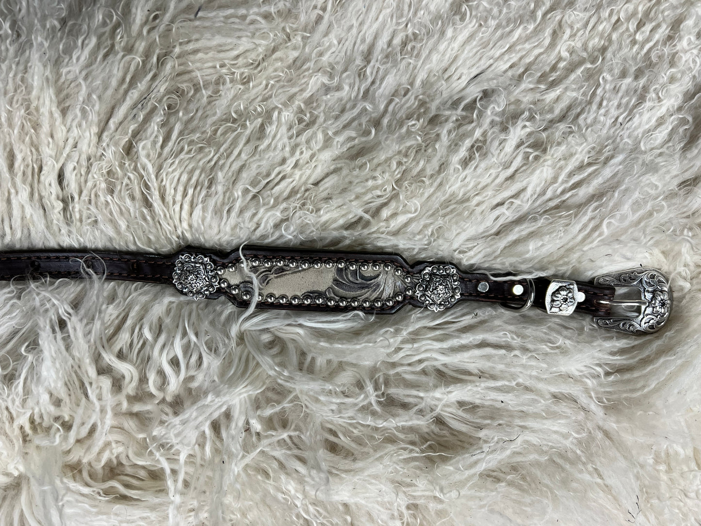 Stone floral on dark leather