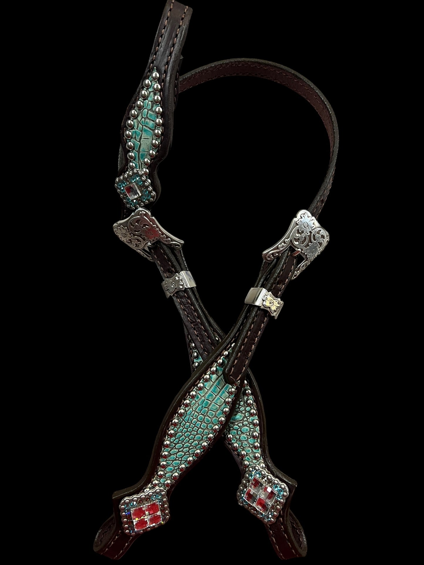 Antique turquoise gator on dark leather