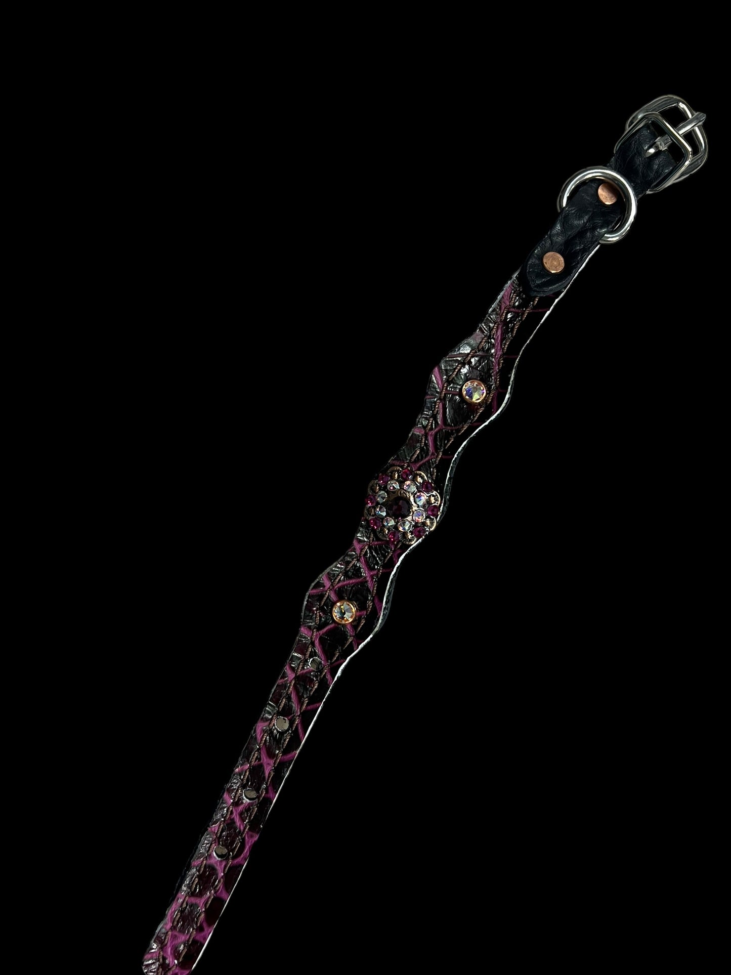 Fuchsia gator on dark leather