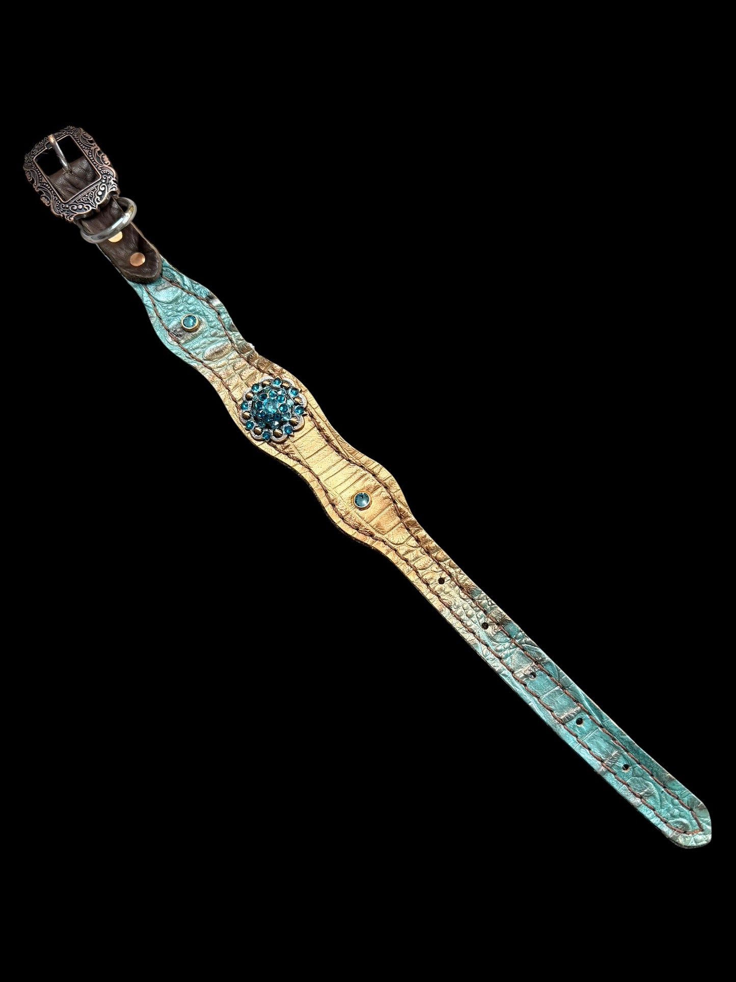 Brown and teal gator on dark leather