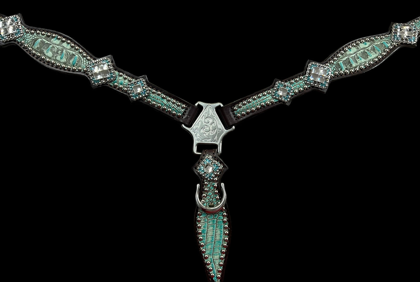 Antique turquoise gator on dark leather