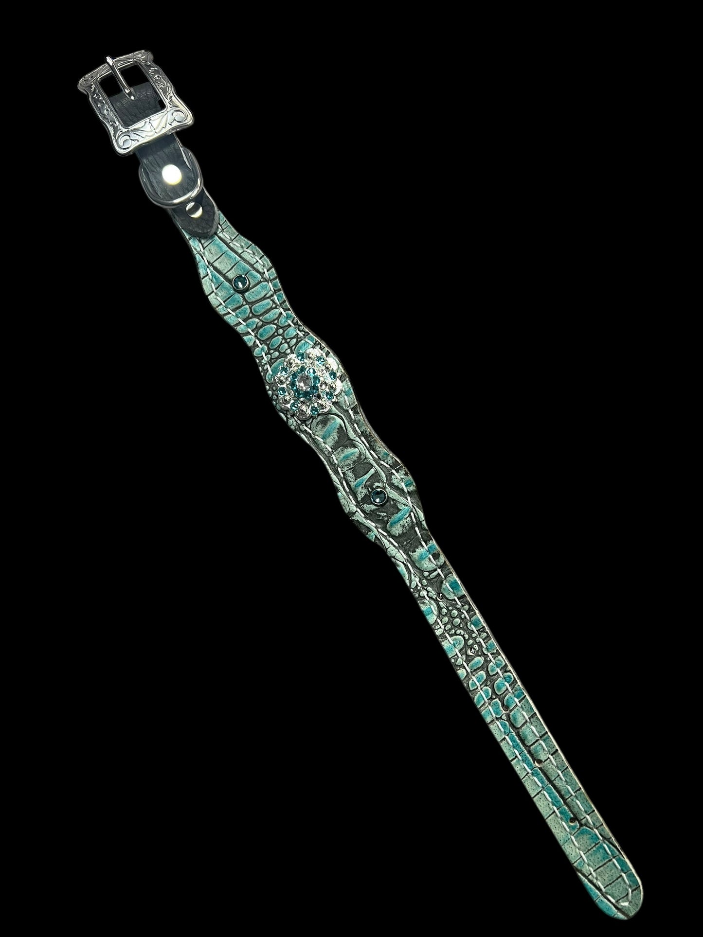 Antique turquoise gator on dark leather