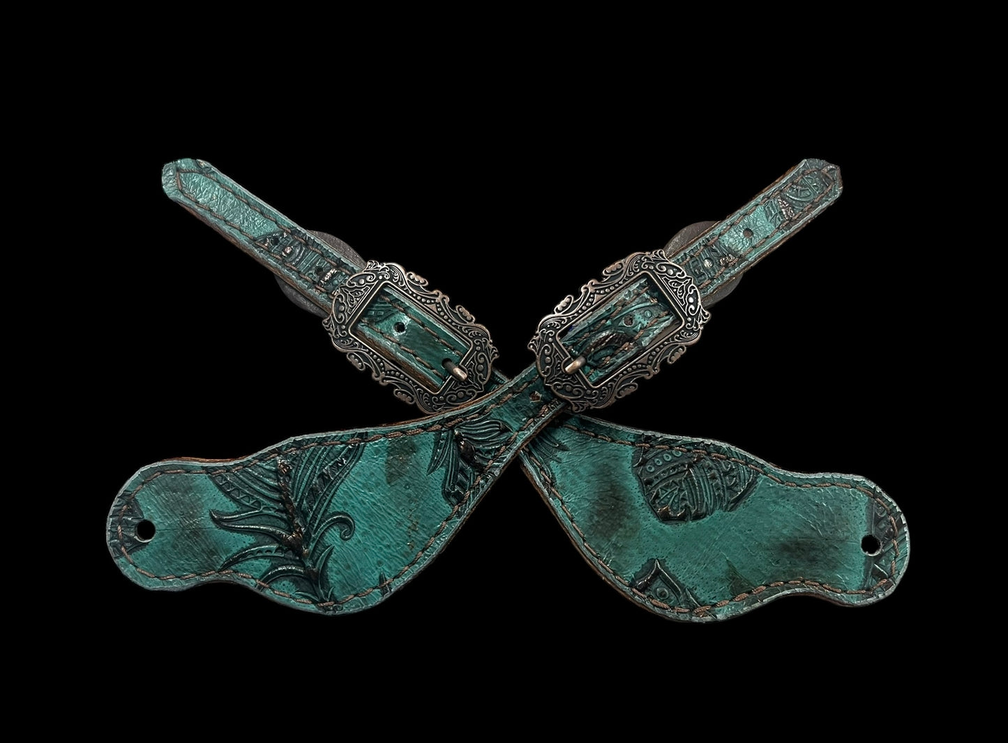 jade feathers on dark leather