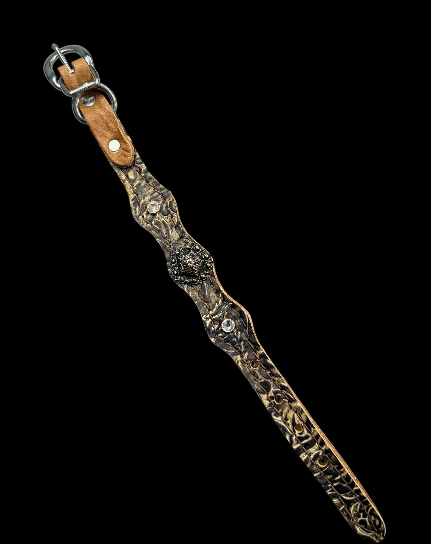 cream and brown daisy on dark leather