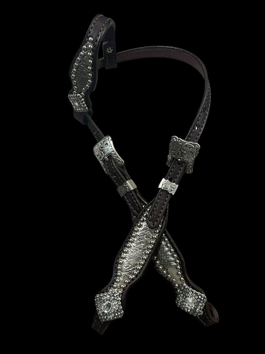 Silver snake on dark leather