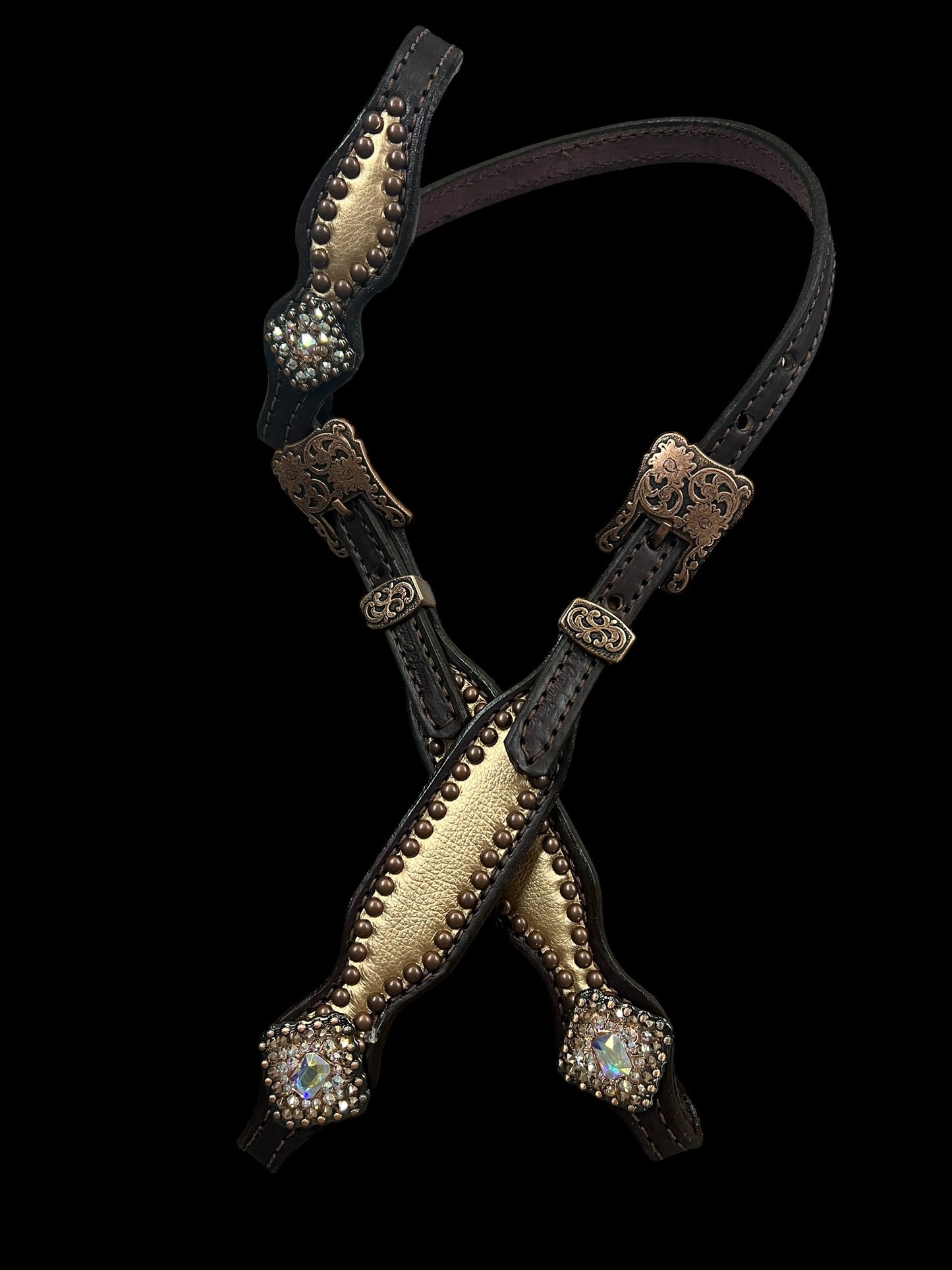 Rose gold on dark leather