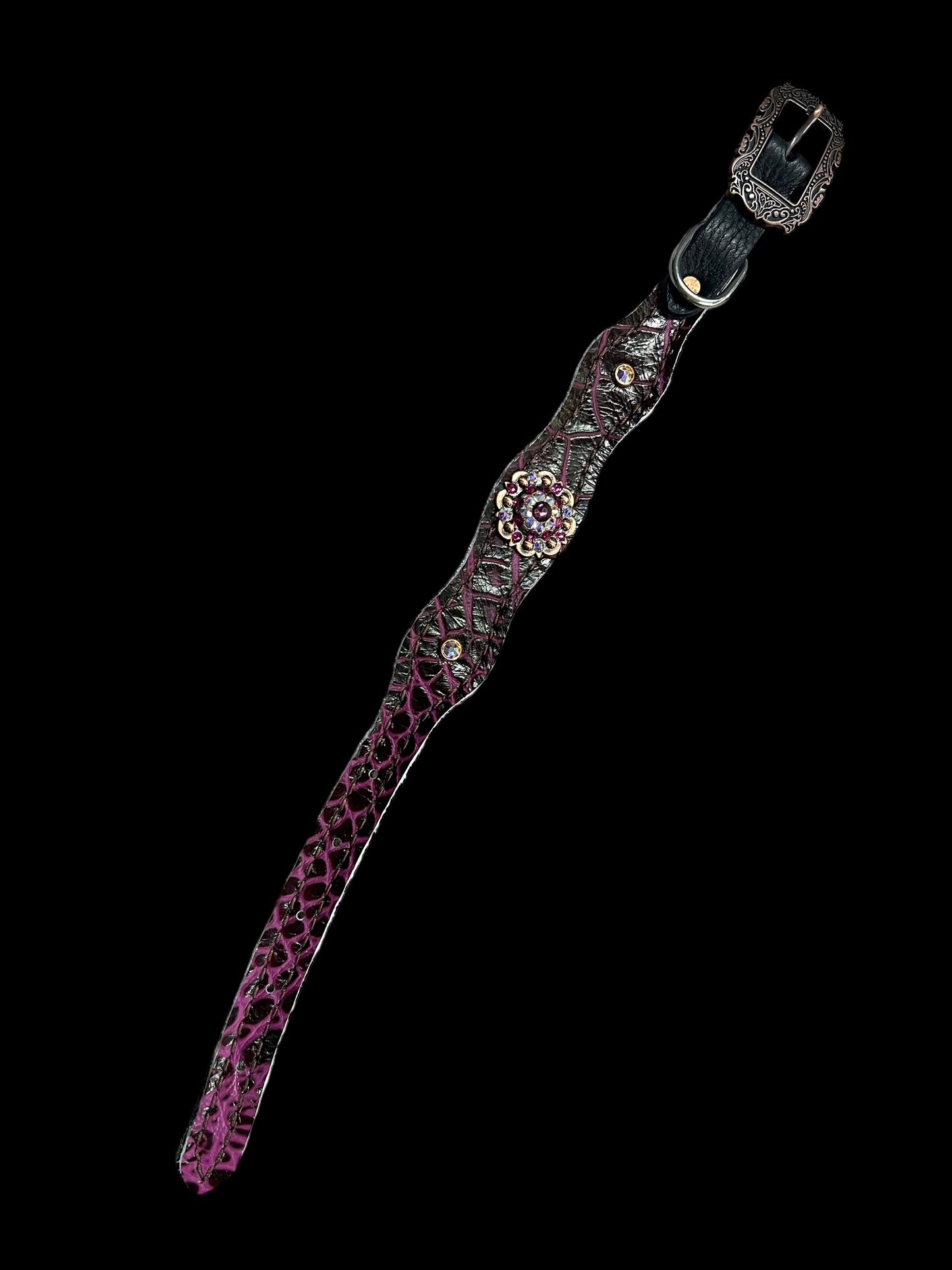 Fuchsia gator on dark leather