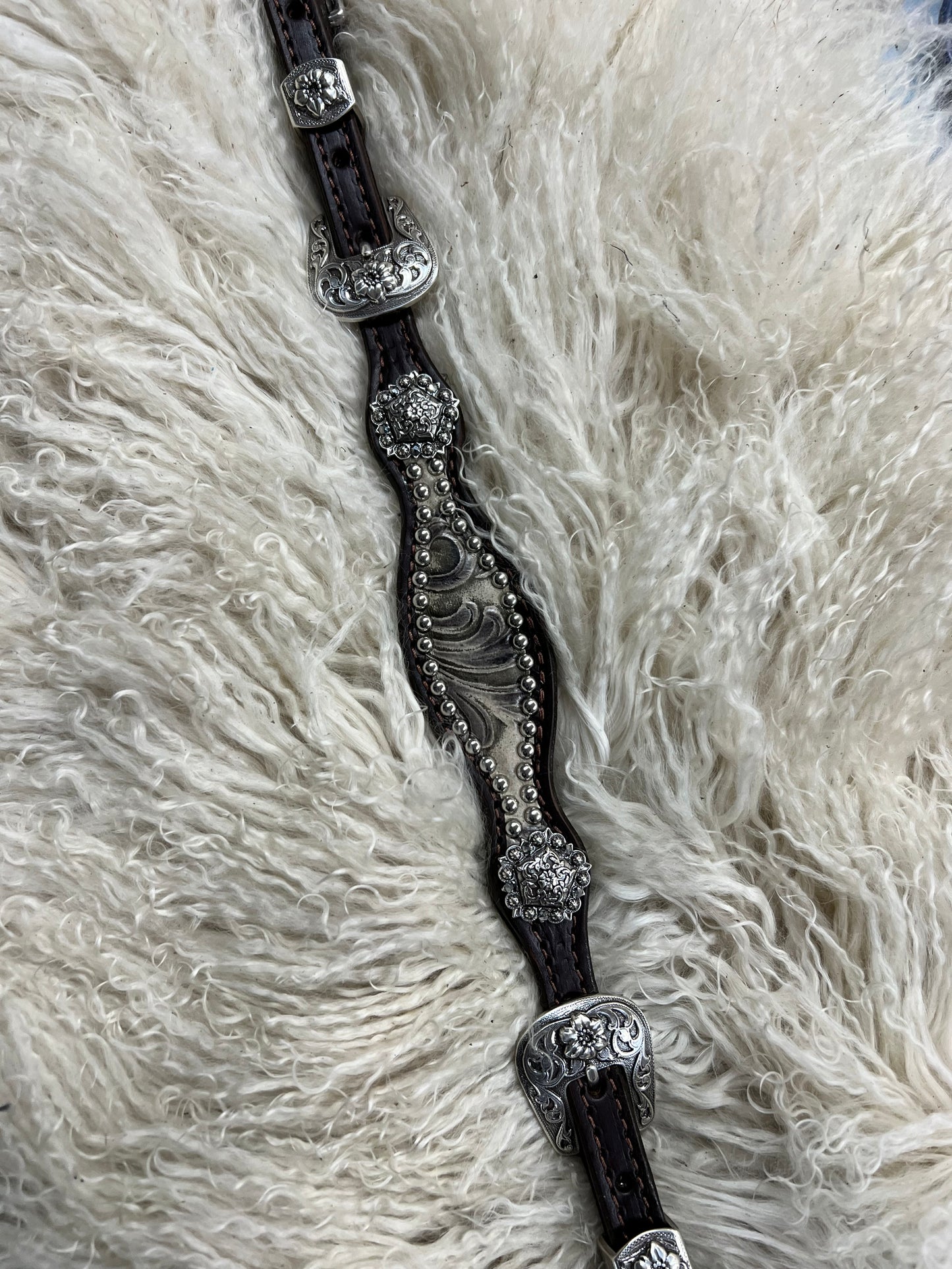 Stone floral on dark leather