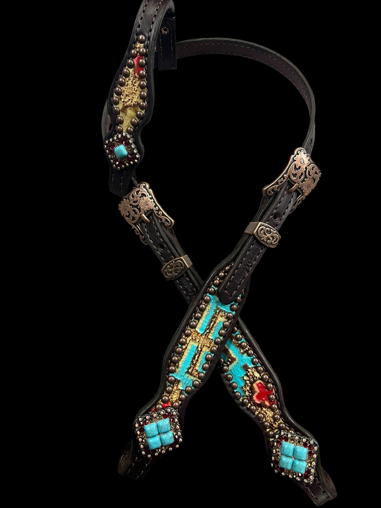 Tan, red, and turquoise Taos on dark leather