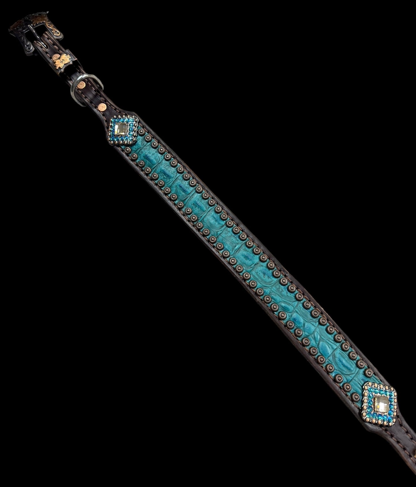 Teal gator on dark leather