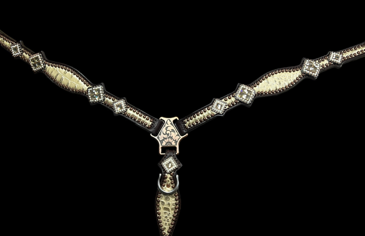 Champagne gator on dark leather