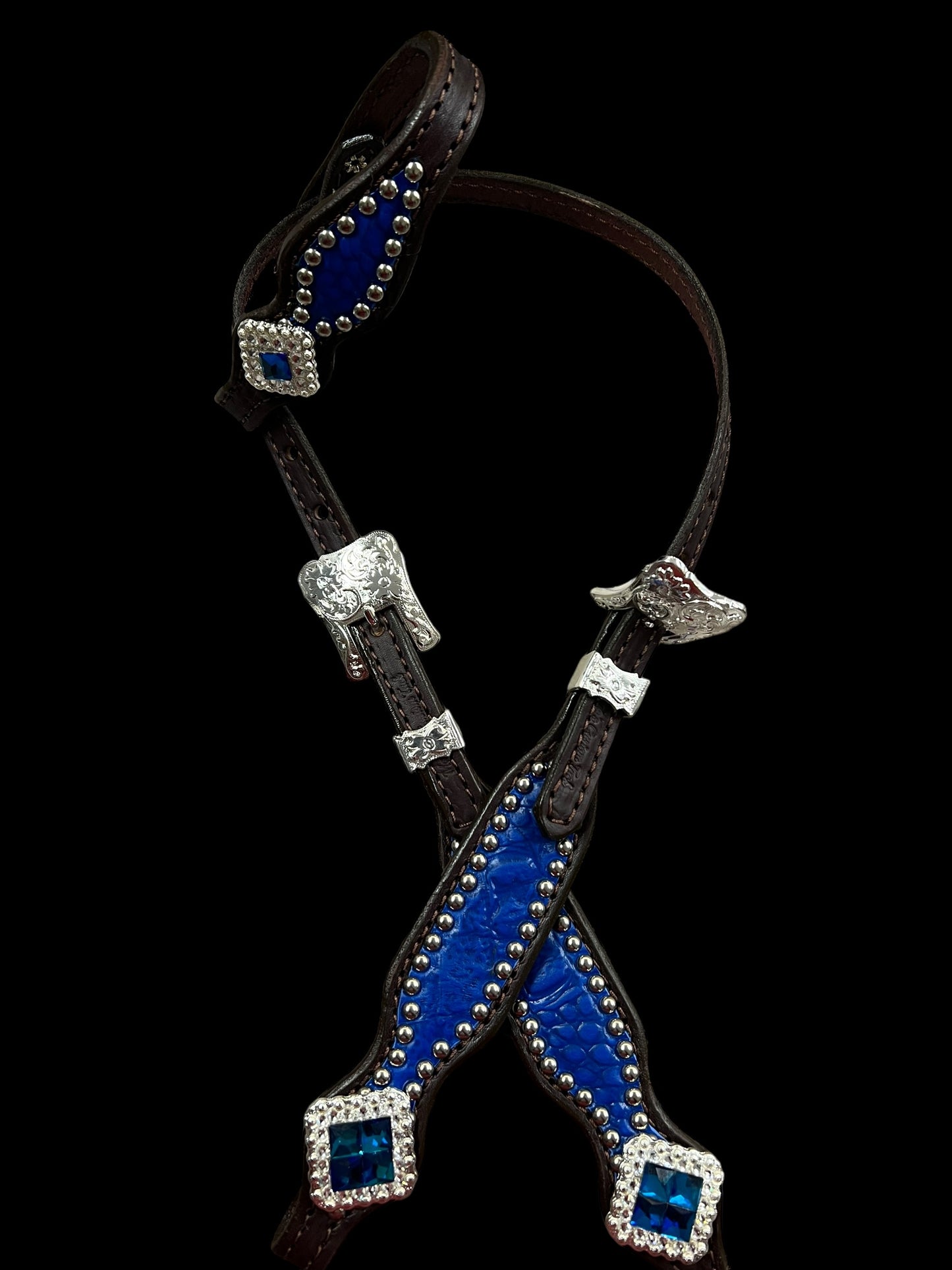 Blue gator on dark leather with blue rhinestones