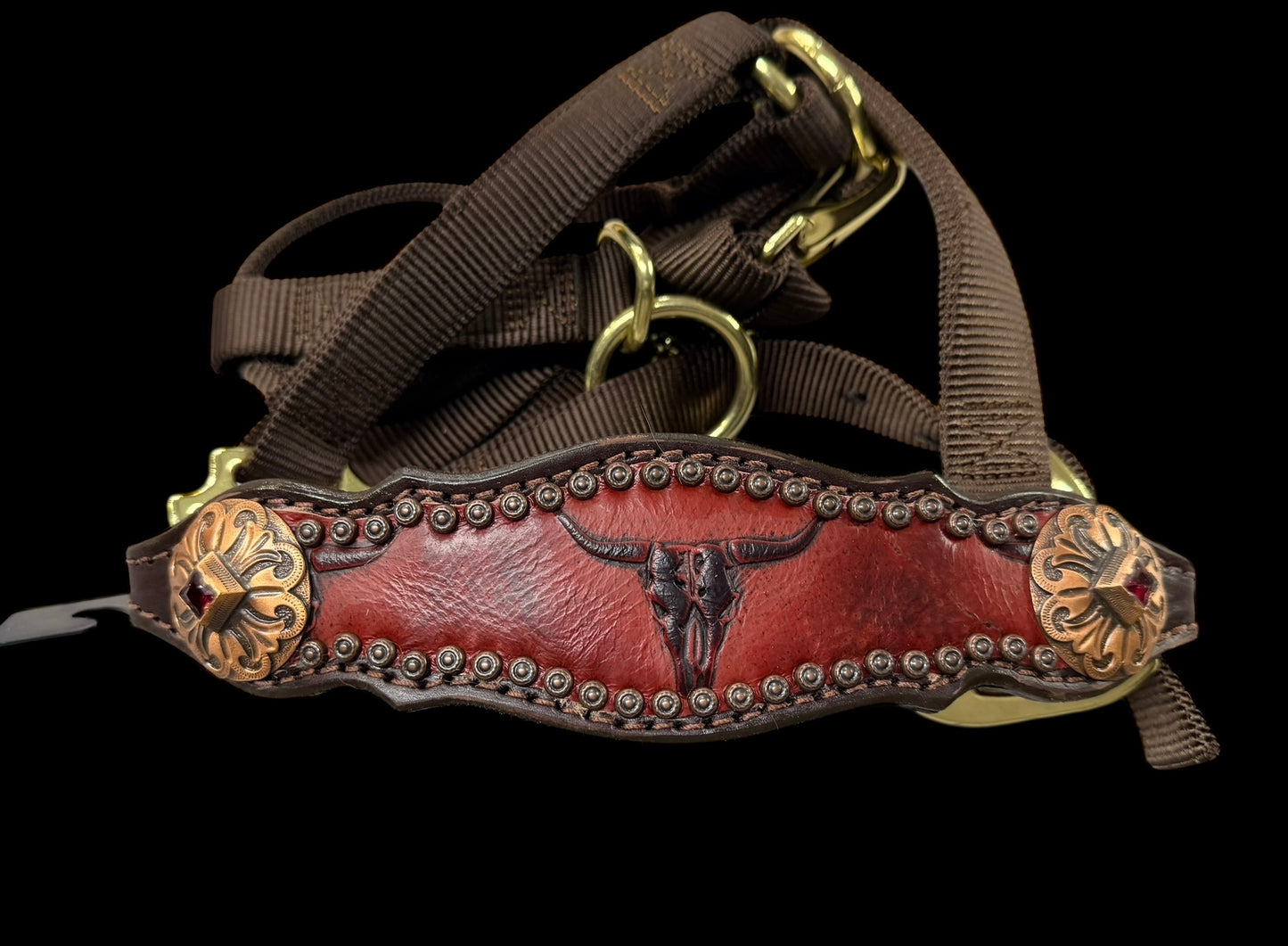 Red longhorns on dark leather
