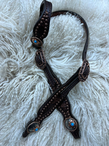 Brown floral on dark leather