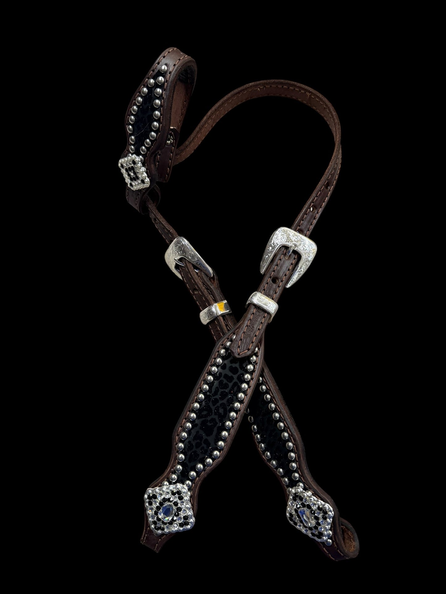 Black flocked leopard on dark leather