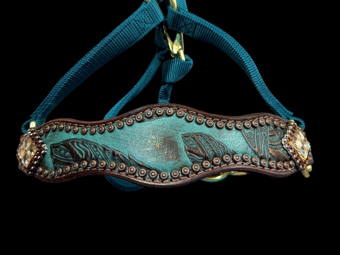 jade feathers on dark leather