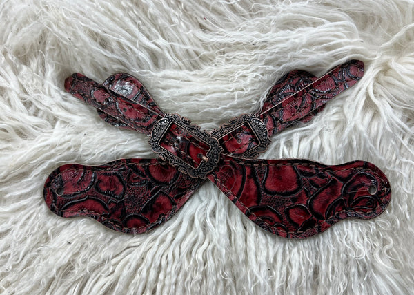Red roses on dark leather