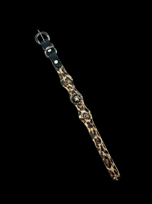 Leopard on dark leather