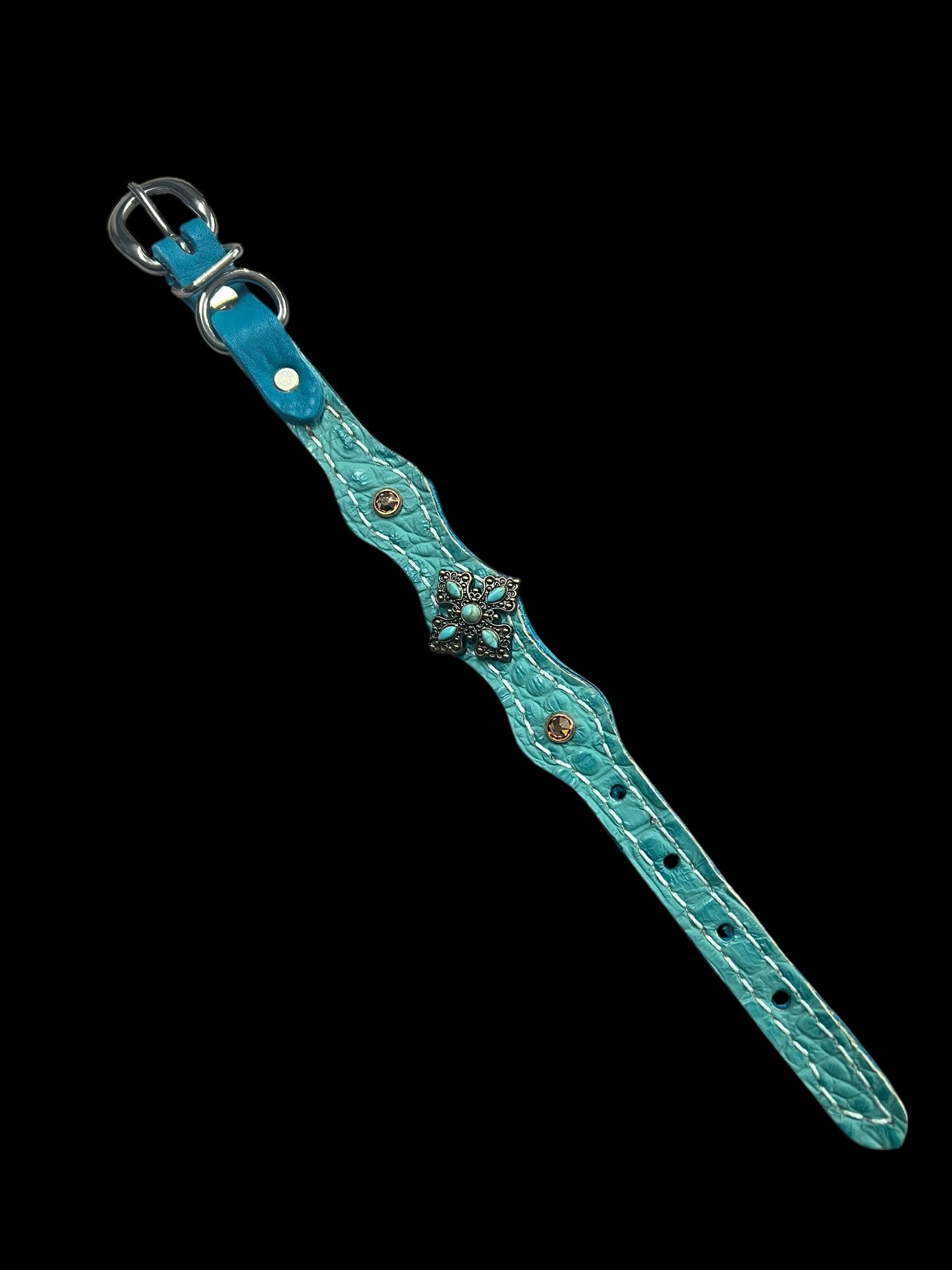 Turquoise gator on dark leather