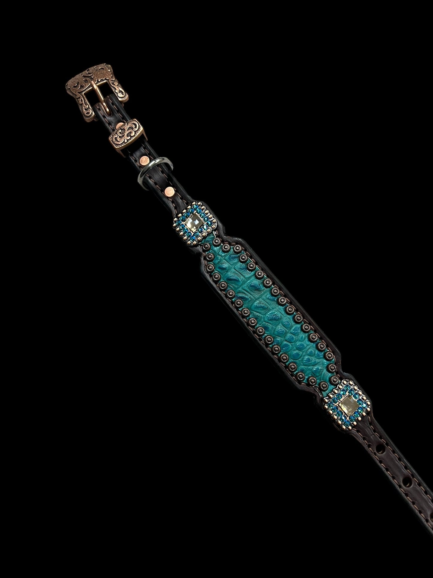 Teal gator on dark leather