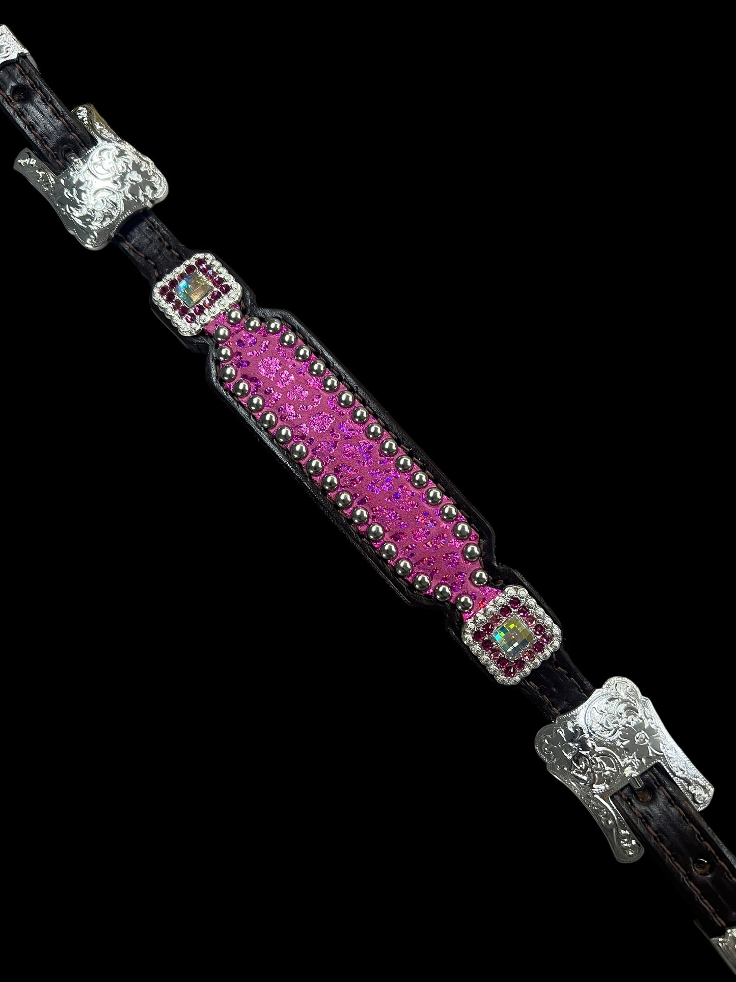 Pink leopard on dark leather