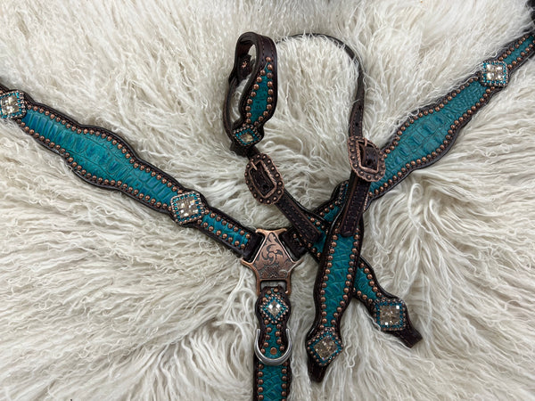 Teal gator on dark leather