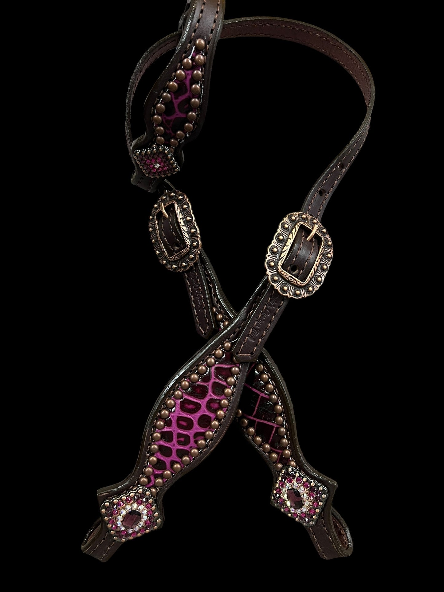 Fuchsia  gator on dark leather