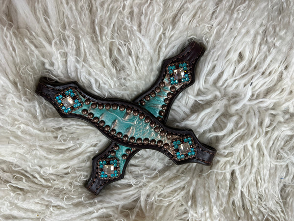Brown and teal gator on dark leather