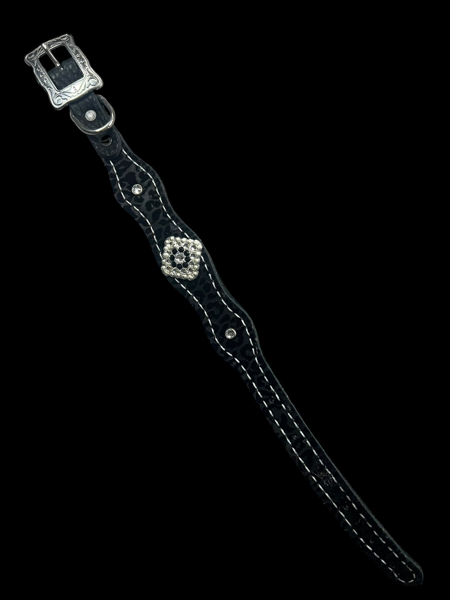 Black flocked leopard on dark leather