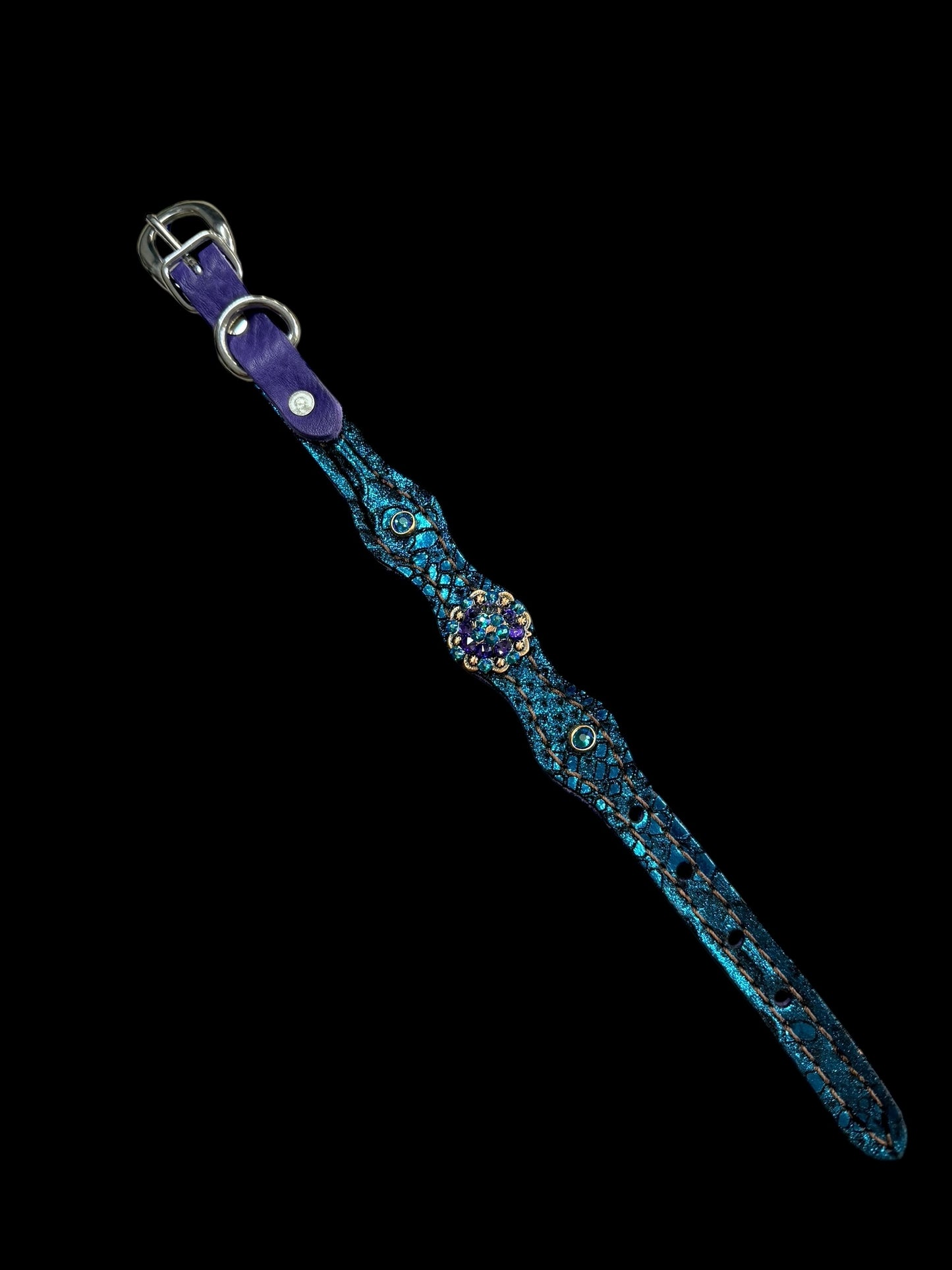 Teal and purple mystic on dark leather