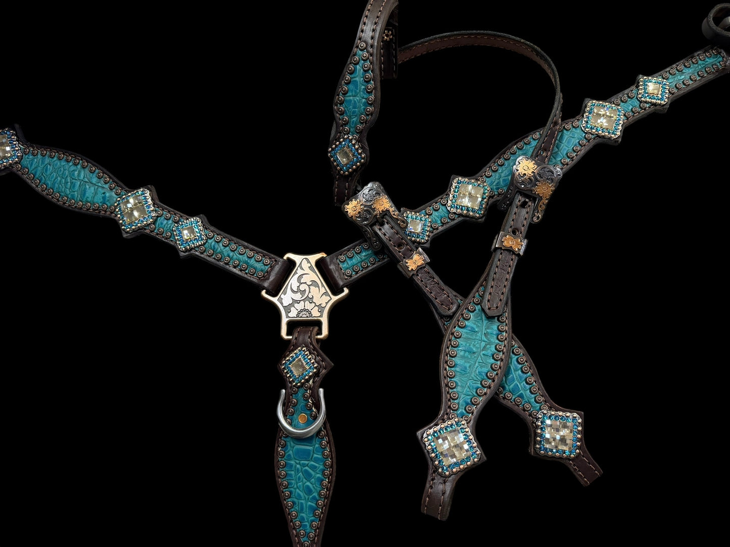 Teal gator on dark leather