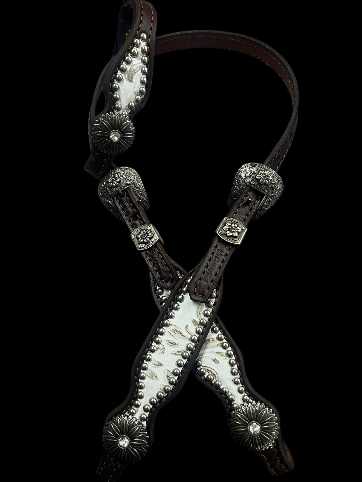 White and silver floral on dark leather