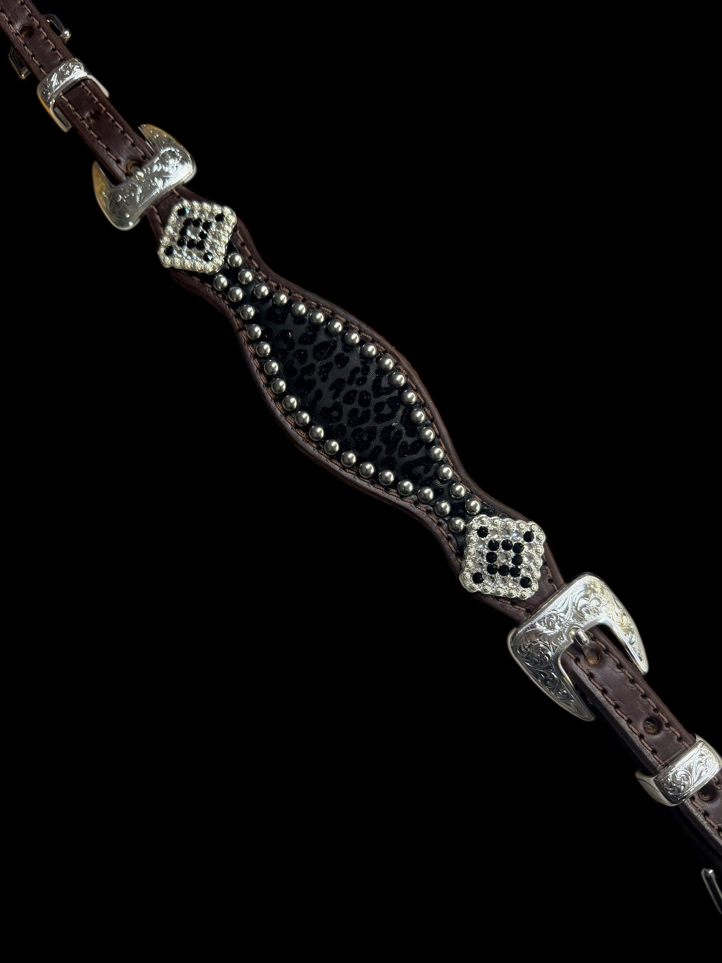 Black flocked leopard on dark leather