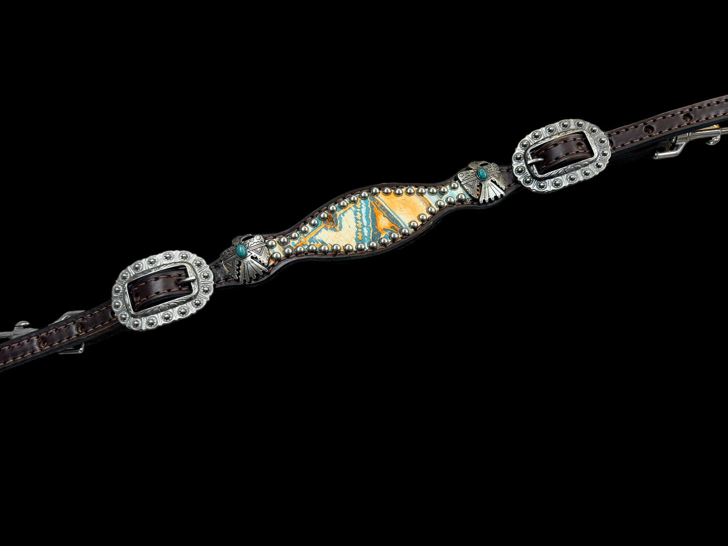 Orange and turquoise navajo on dark leather