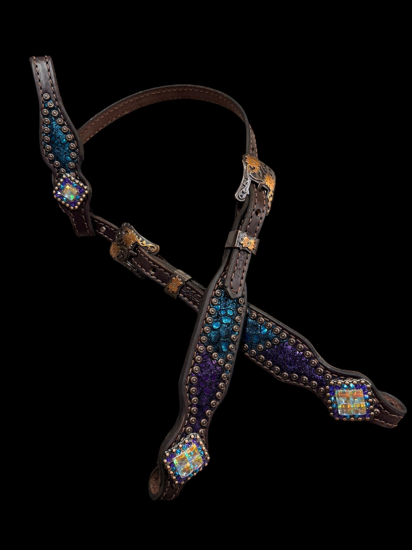 Teal and purple mystic on dark leather