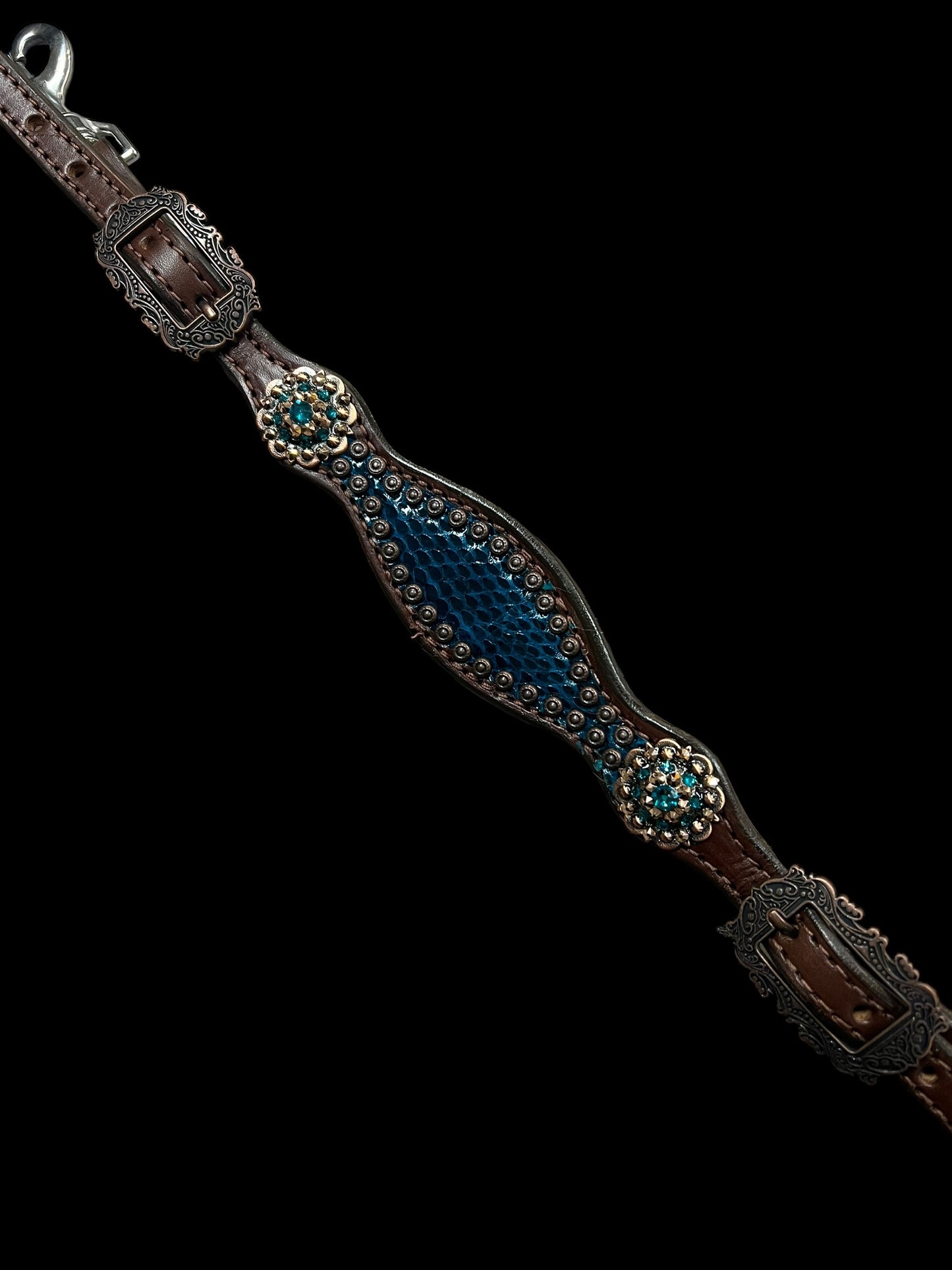 Teal snake on walnut leather