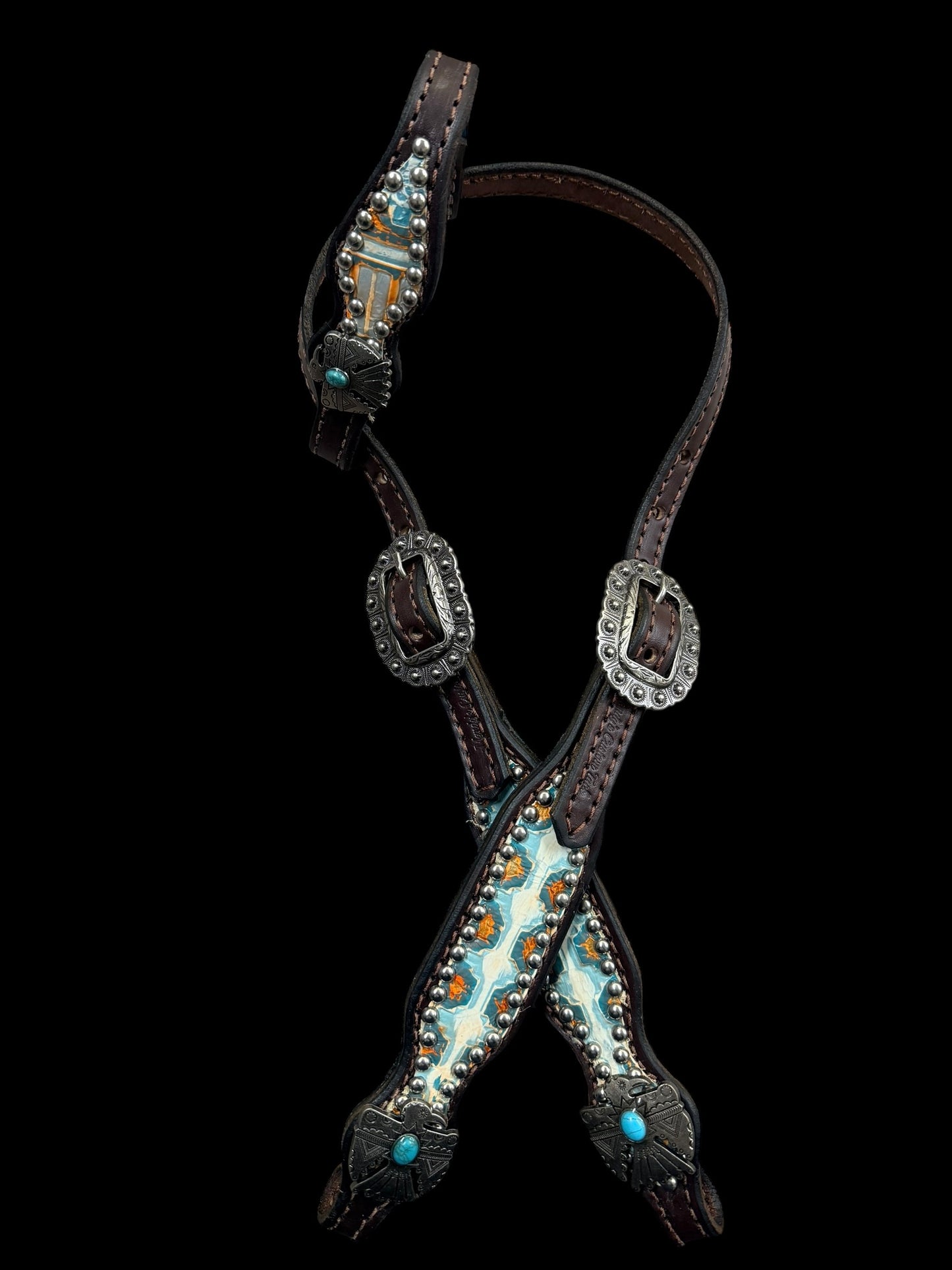 Orange and turquoise navajo on dark leather