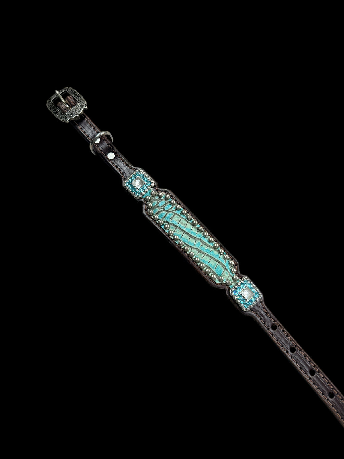 Antique turquoise gator on dark leather
