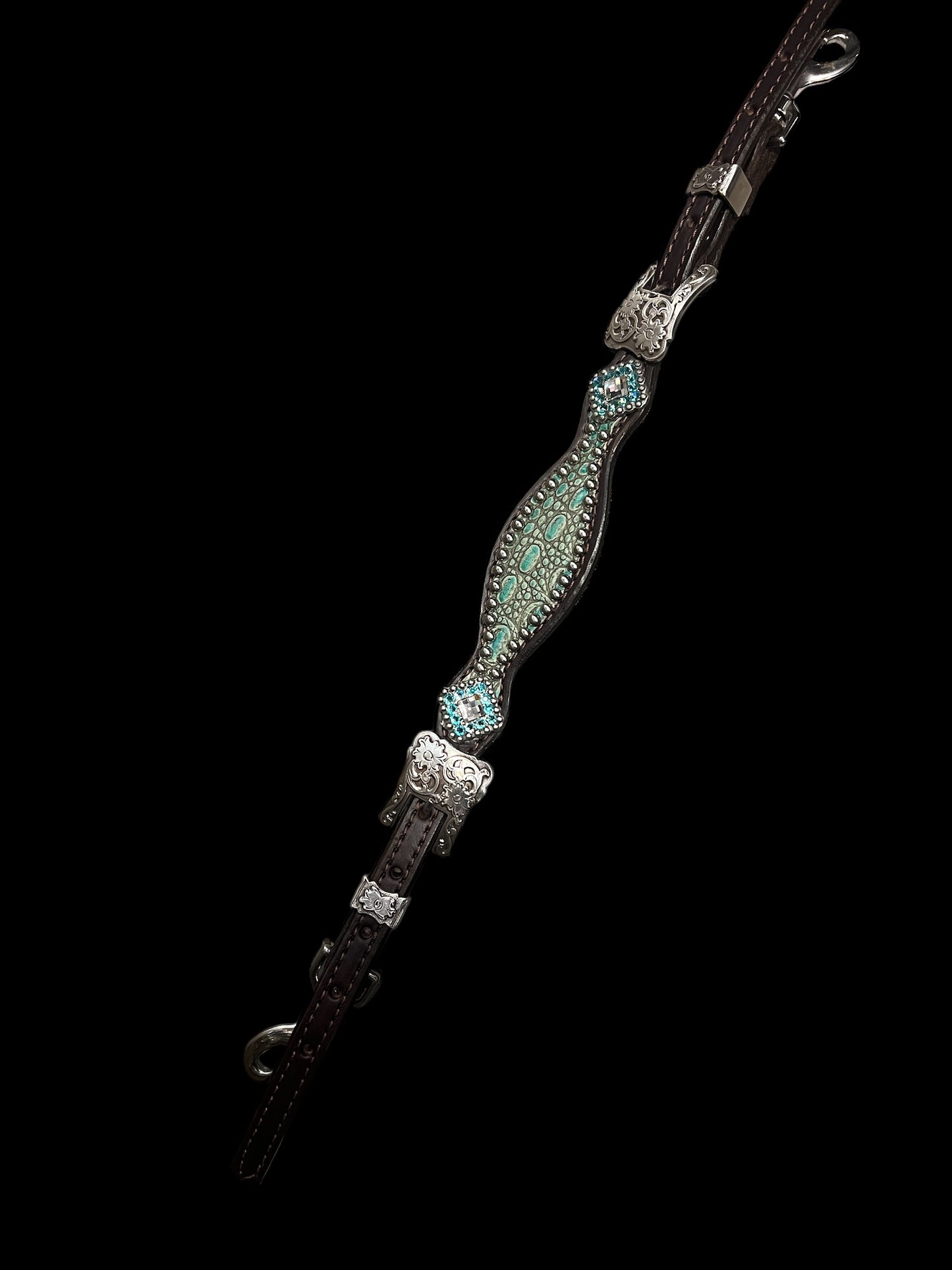 Antique turquoise gator on dark leather